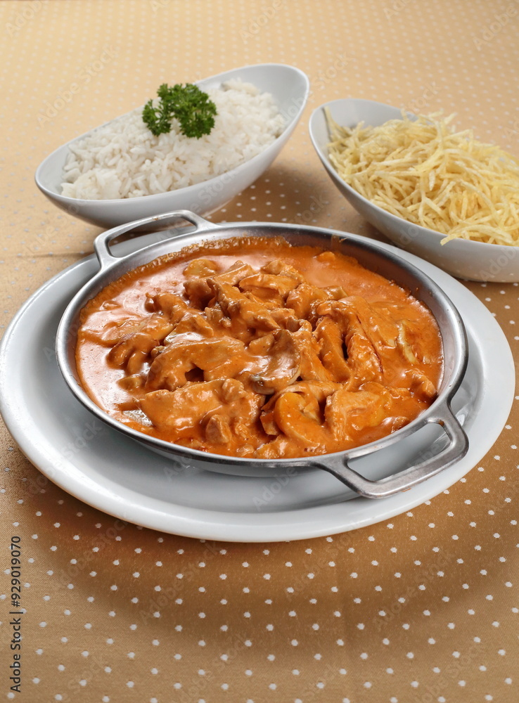 Chicken Stroganoff with white rice and French fries Chicken Stroganoff with white rice and French fries