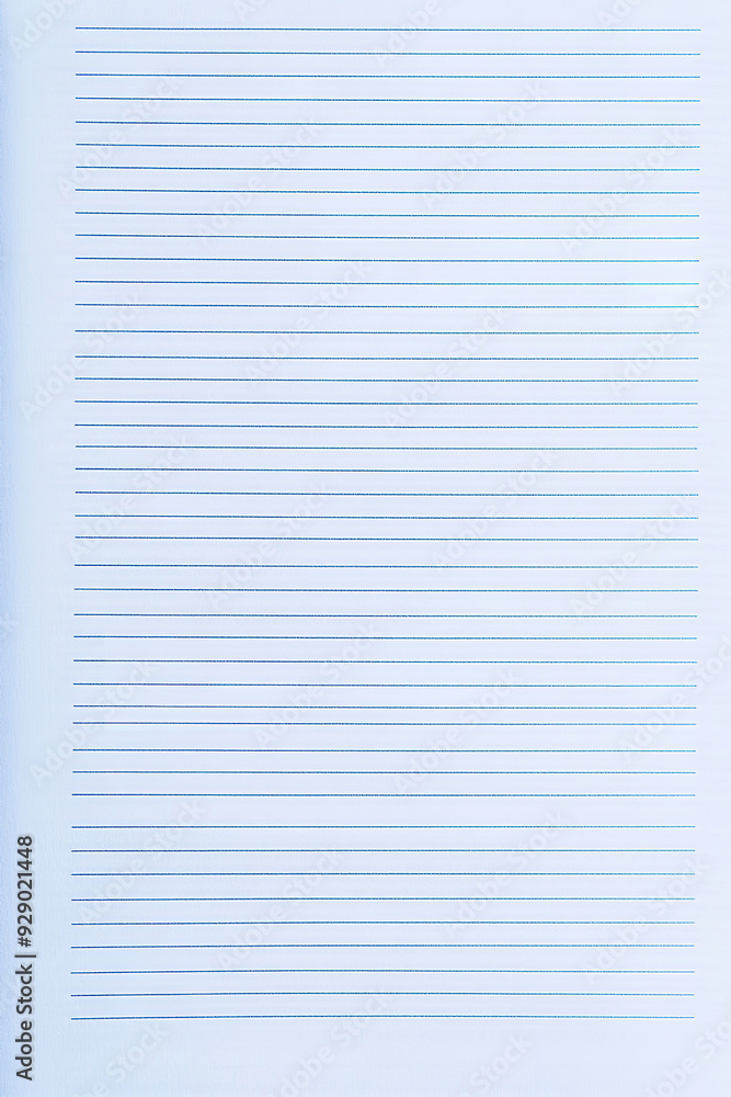 A sheet of blue lined paper features evenly spaced horizontal lines in a soft, calming blue shade A sheet of blue lined paper features evenly spaced horizontal lines in a soft, calming blue shade