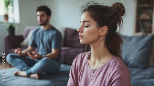 Woman stressed husband meditates peacefully amid tension