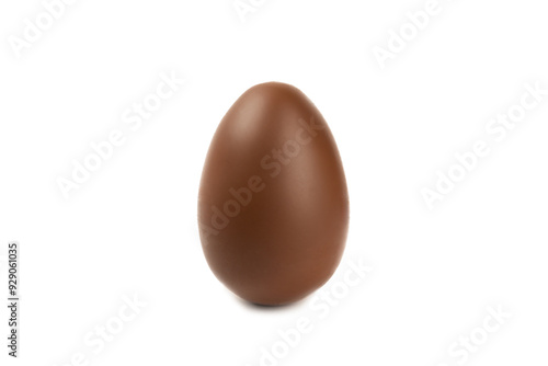 Easter chocolate egg isolated on white background. Easter celebration concept. Happy Easter. Chocolate sweet eggs. Candies on textured wooden table. Space for text.Copy space