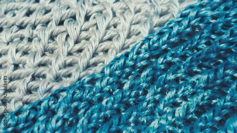 Close-up of knitting techniques with blue and gray yarn at a crafting session Close-up of knitting techniques with blue and gray yarn at a crafting session