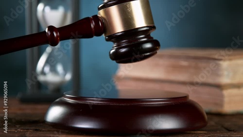 Super slow motion of gavel being struck to decide an auction or guilty verdict in court . Filmed on high speed cinematic camera at 1000 fps