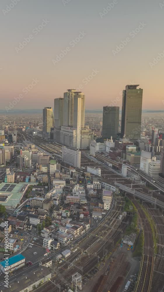 Nagoya Aichi Japan time lapse city skyline night to day at railway station and business center (Vertical) Nagoya Aichi Japan time lapse city skyline night to day at railway station and business center (Vertical)