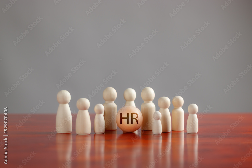 Concept of human resource management, HRM, recruitment, HR, personnel selection, appropriate leadership for the organization,Close-up round HR text stick with stick figures standing in row on table Concept of human resource management, HRM, recruitment, HR, personnel selection, appropriate leadership for the organization,Close-up round HR text stick with stick figures standing in row on table