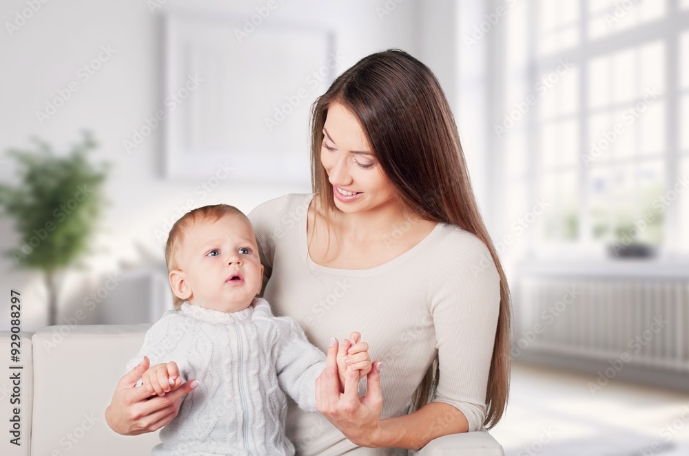 Young happy woman hold cute newborn baby