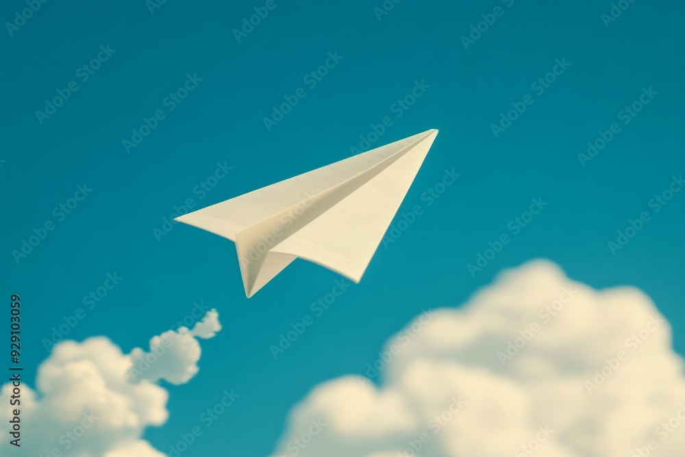 A paper airplane soaring through a clear blue sky amidst fluffy white clouds A paper airplane soaring through a clear blue sky amidst fluffy white clouds