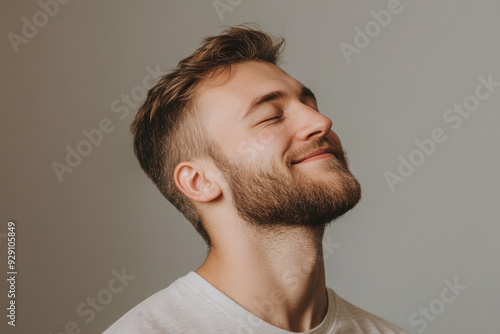 A close up of a man's face with his eyes closed