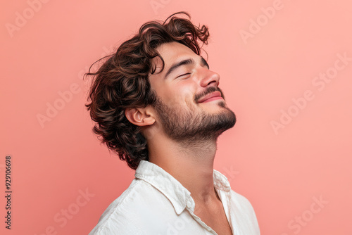 A close up of a man's face with his eyes closed