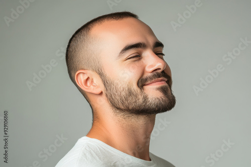 A close up of a man's face with his eyes closed