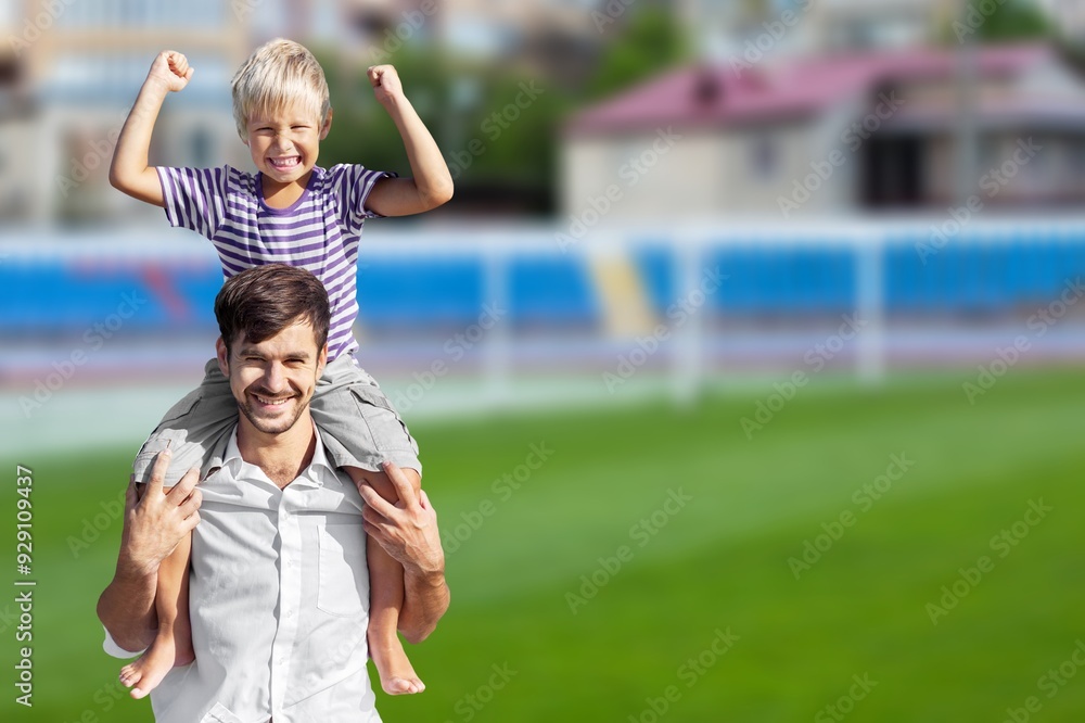 Obraz premium Happy father with small son on field at summer
