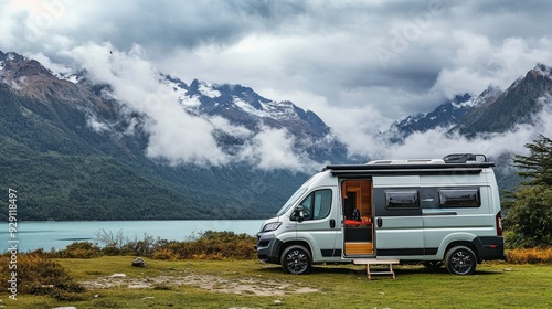 Modern RV camper van parked in a scenic outdoor location. Highlights of vanlife, travel lifestyle, and adventure. Vehicle at the destination, embodying freedom and the journey. 