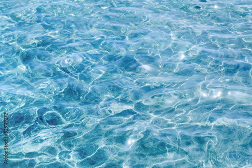 Crystal clear water surface of the sea With gentle waves and ripples texture, creating a beautiful picture