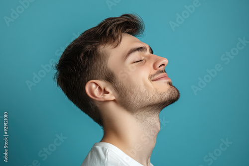 A close up of a man's face with his eyes closed