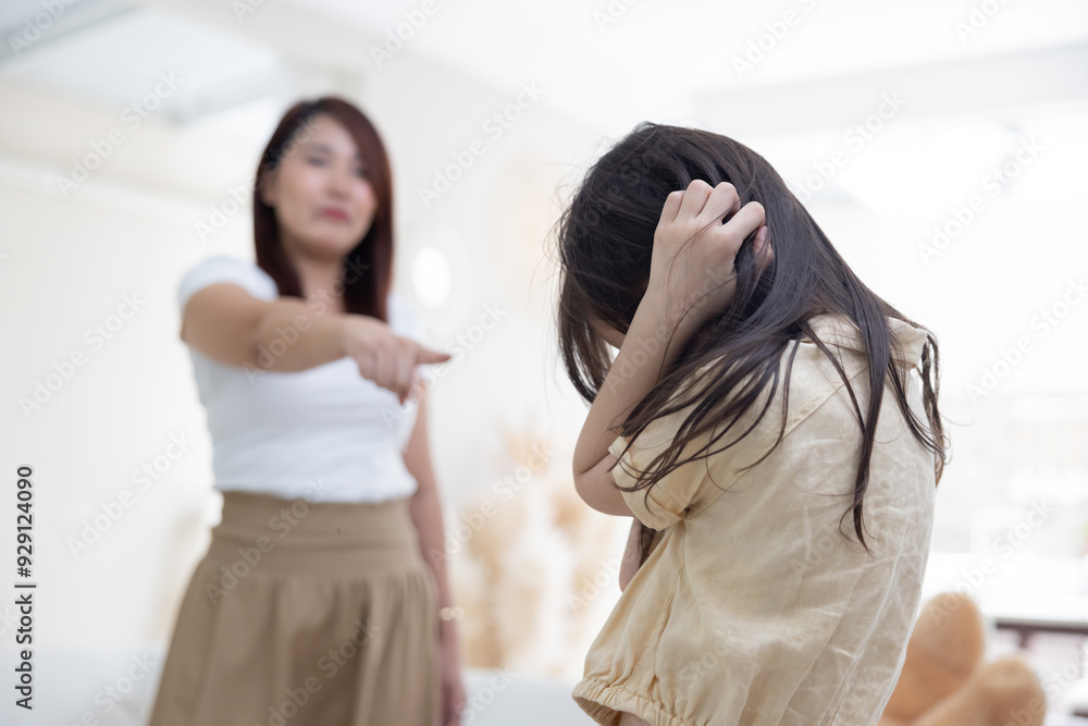 Naklejka premium Angry Asian Mother Yelling at Her Stubborn Daughter