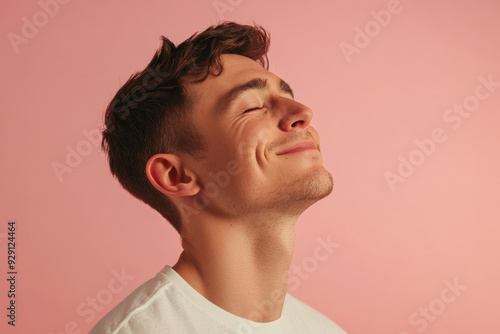 A close up of a man's face with his eyes closed