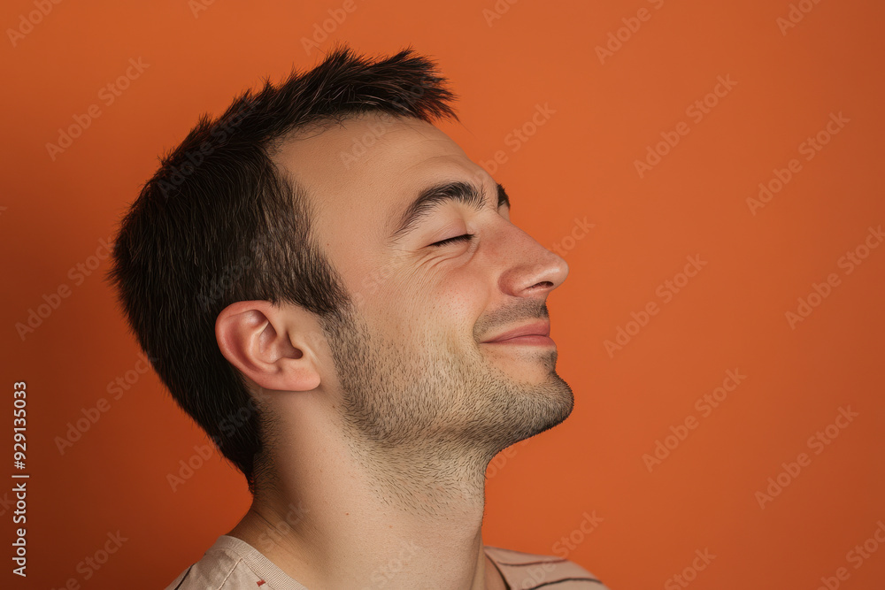 Obraz premium A close up of a man's face with his eyes closed