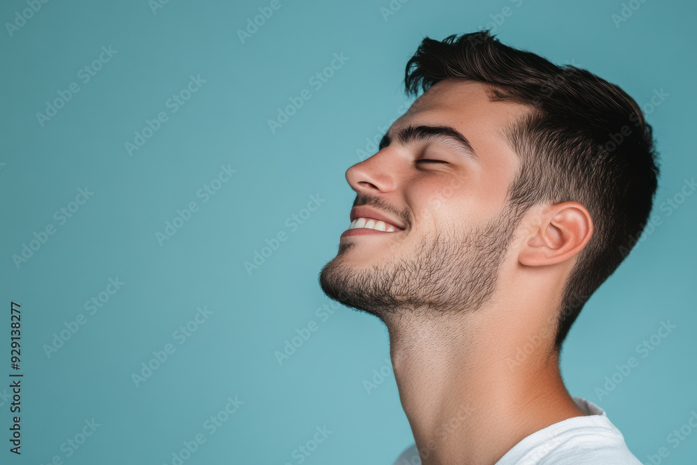 Obraz premium A close up of a man's face with his eyes closed