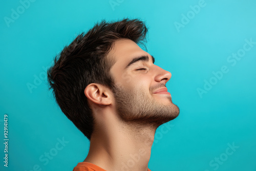 A close up of a man's face with his eyes closed