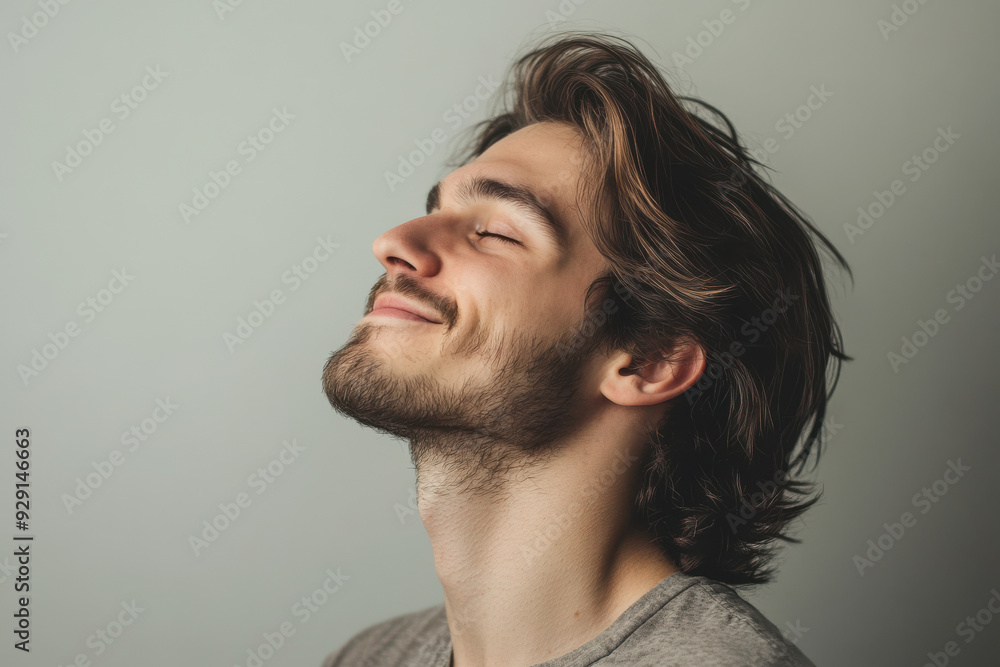 A close up of a man's face with his eyes closed