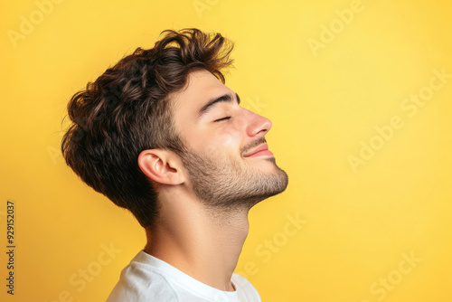 A close up of a man's face with his eyes closed