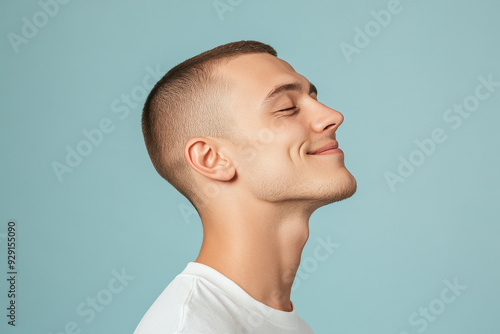 A close up of a man's face with his eyes closed