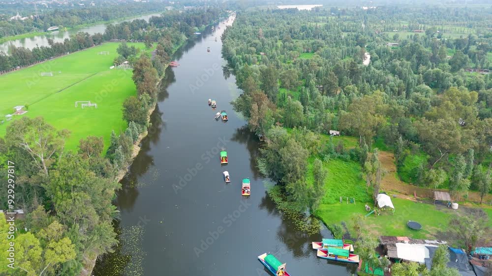 Aerial video over Xochimilco, Mexico City: where you can observe its peaceful canals of serene waters among its endemic vegetation and playful fields. Aerial video over Xochimilco, Mexico City: where you can observe its peaceful canals of serene waters among its endemic vegetation and playful fields.
