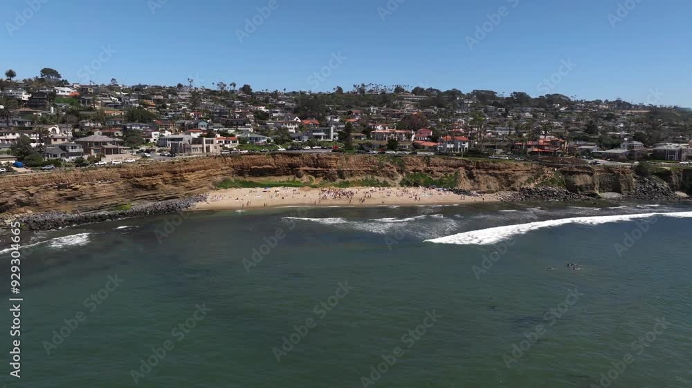 Aerial view of the beach at Sunset Cliffs in Ocean Beach San Diego on a sunny summer day with people enjoying the Pacific Ocean sand and surf Aerial view of the beach at Sunset Cliffs in Ocean Beach San Diego on a sunny summer day with people enjoying the Pacific Ocean sand and surf