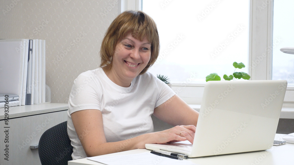 Young Female Freelancer Working on a Computer Young Female Freelancer Working on a Computer