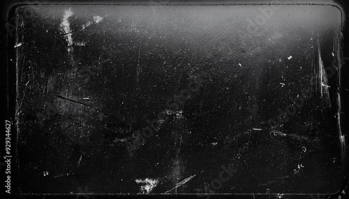 Dusty scratched and scanned old film texture with cracks; dirty grunge style overlay for photo or banner