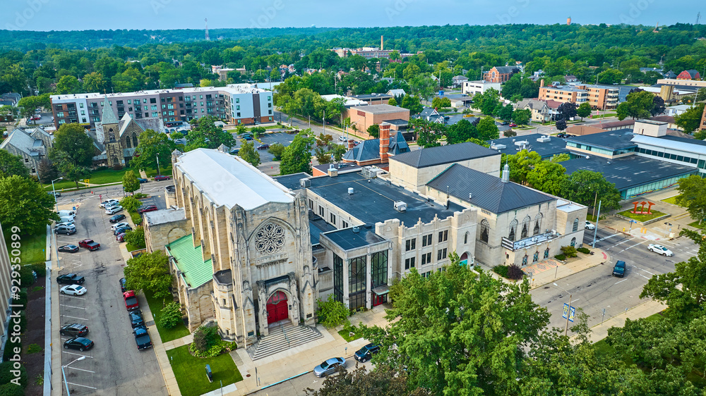 Fototapeta premium Aerial View of Gothic Church and Urban Landscape in Kalamazoo