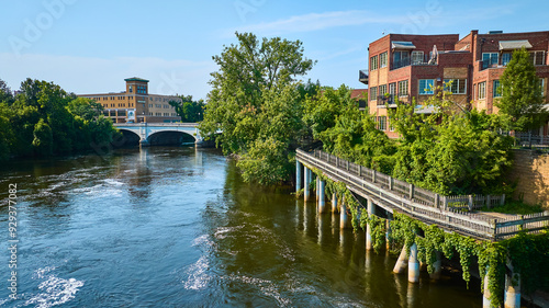 Aerial Fly Over Historic Bridge and Riverside Red-Brick Buildings in South Bend