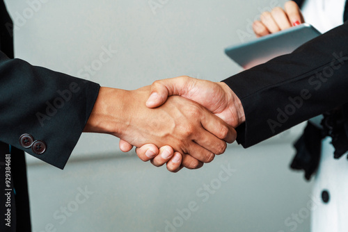 Business people agreement concept. Businessman do handshake with another businessman in the office meeting room. uds