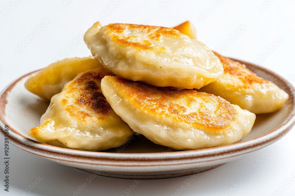 Pierogi, Dumplings filled with a variety of ingredients such as potatoes, cheese, meat, or fruit, typically boiled and then sometimes fried., Isolated on White Background Pierogi, Dumplings filled with a variety of ingredients such as potatoes, cheese, meat, or fruit, typically boiled and then sometimes fried., Isolated on White Background