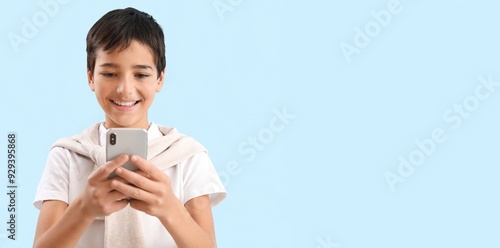 Little boy using mobile pho...