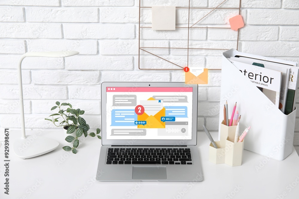 Fototapeta premium Received email messages on screen of laptop at workplace