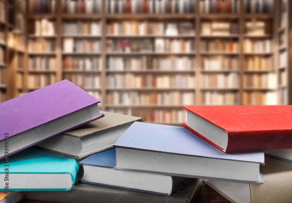 Fototapeta premium Set of reading books on table in library, education