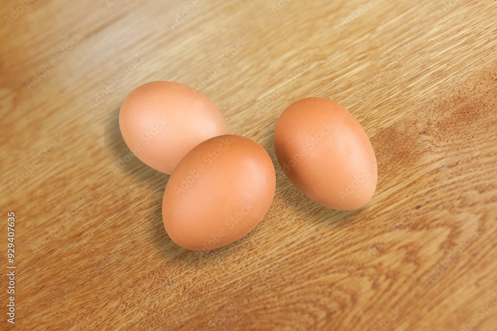 Stack of fresh tasty chicken egg on desk Stack of fresh tasty chicken egg on desk