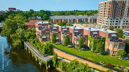 Aerial Fly Through Modern Riverside Townhouses and Riverfront Boardwalk