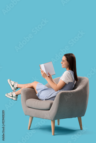 Young woman reading book in...