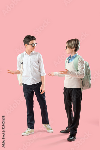 Two young schoolboys in uni...