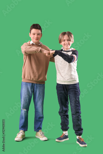 Happy brothers bumping fist...