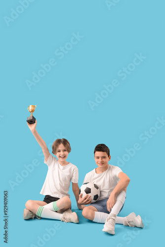 Happy brothers with soccer ...