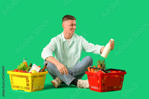 Young man with full shoppin...