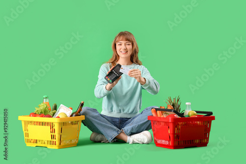 Happy woman using credit ca...