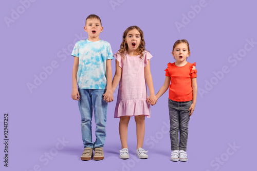 Shocked little kids on purp...