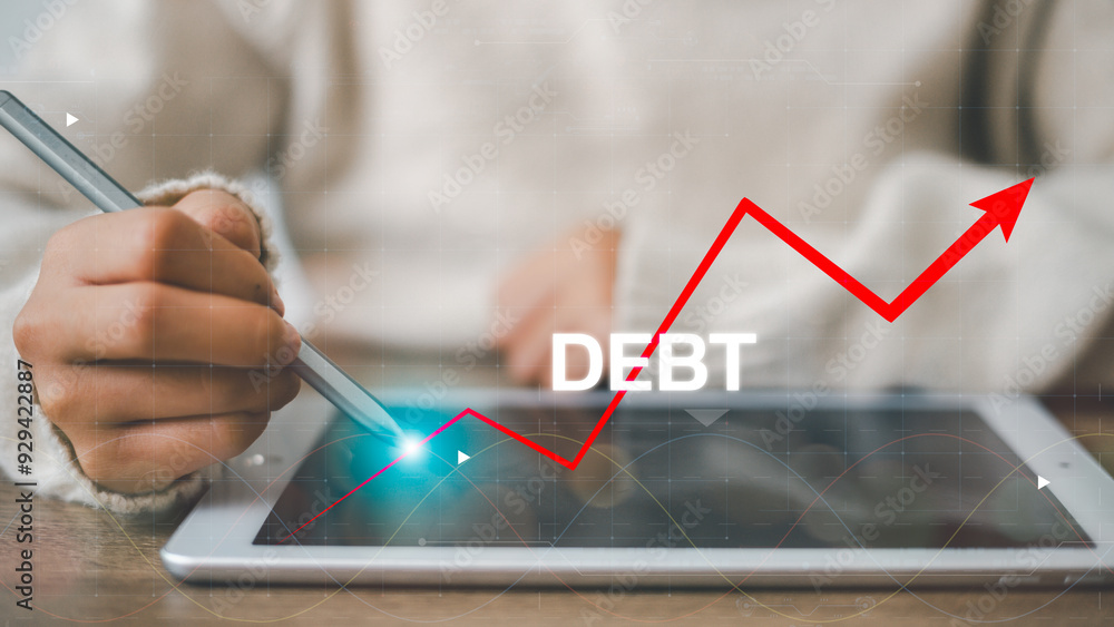 Debt growth on a virtual screen. The financier draws a rating for debt obligations. Concept - growth of public debt. Debt growth on a virtual screen. The financier draws a rating for debt obligations. Concept - growth of public debt.