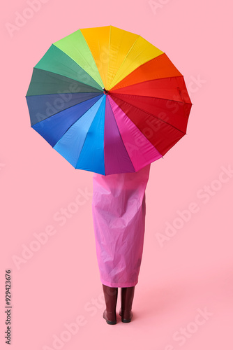 Person in pink raincoat and...