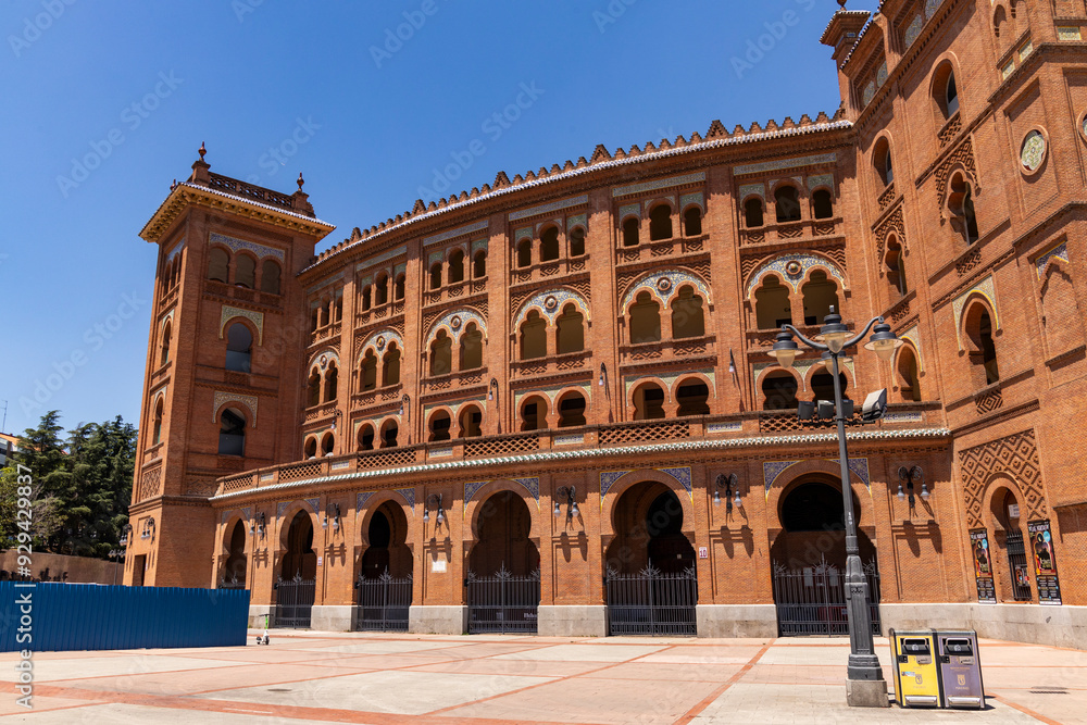 Fototapeta premium Las Ventas bullring, Madrid, Bull square. Plaza de toros. Events and traditions of Spain. Red sand under a burning sun. No people. Fight between matador and bull. Blood, passion, dance, celebration.