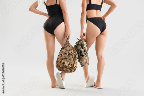Young women in swimsuits wi...