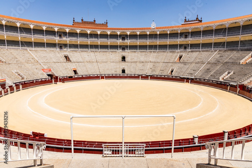 Las Ventas bullring, Madrid, Bull square. Plaza de toros. Events and traditions of Spain. Red sand under a burning sun. No people. Fight between matador and bull. Blood, passion, dance, celebration.